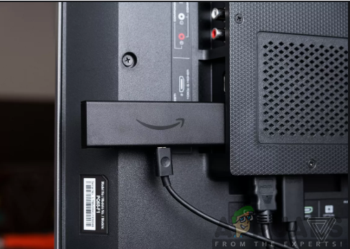 Inserting the Amazon Fire TV Stick into the TV