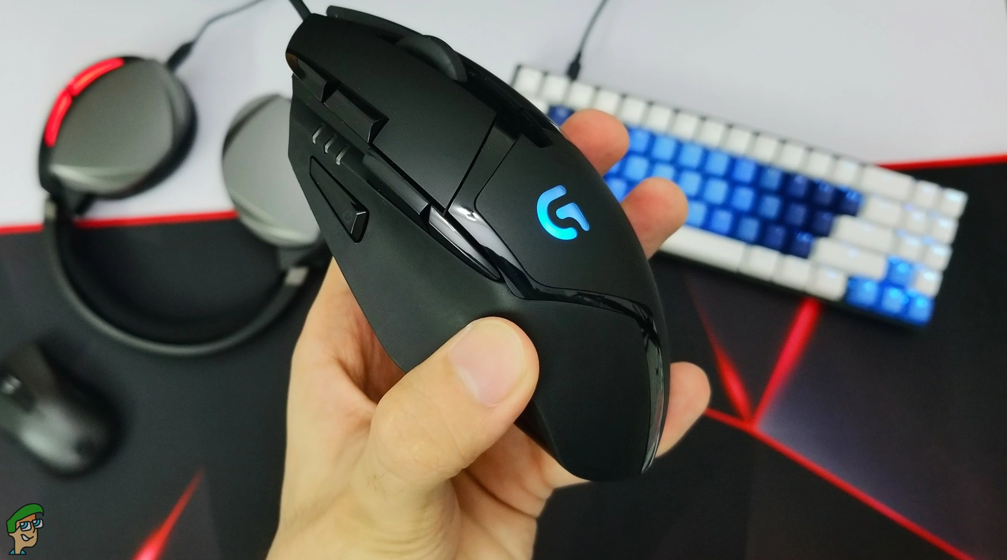Logitech G402 gaming mouse close up shot with a background of our studio