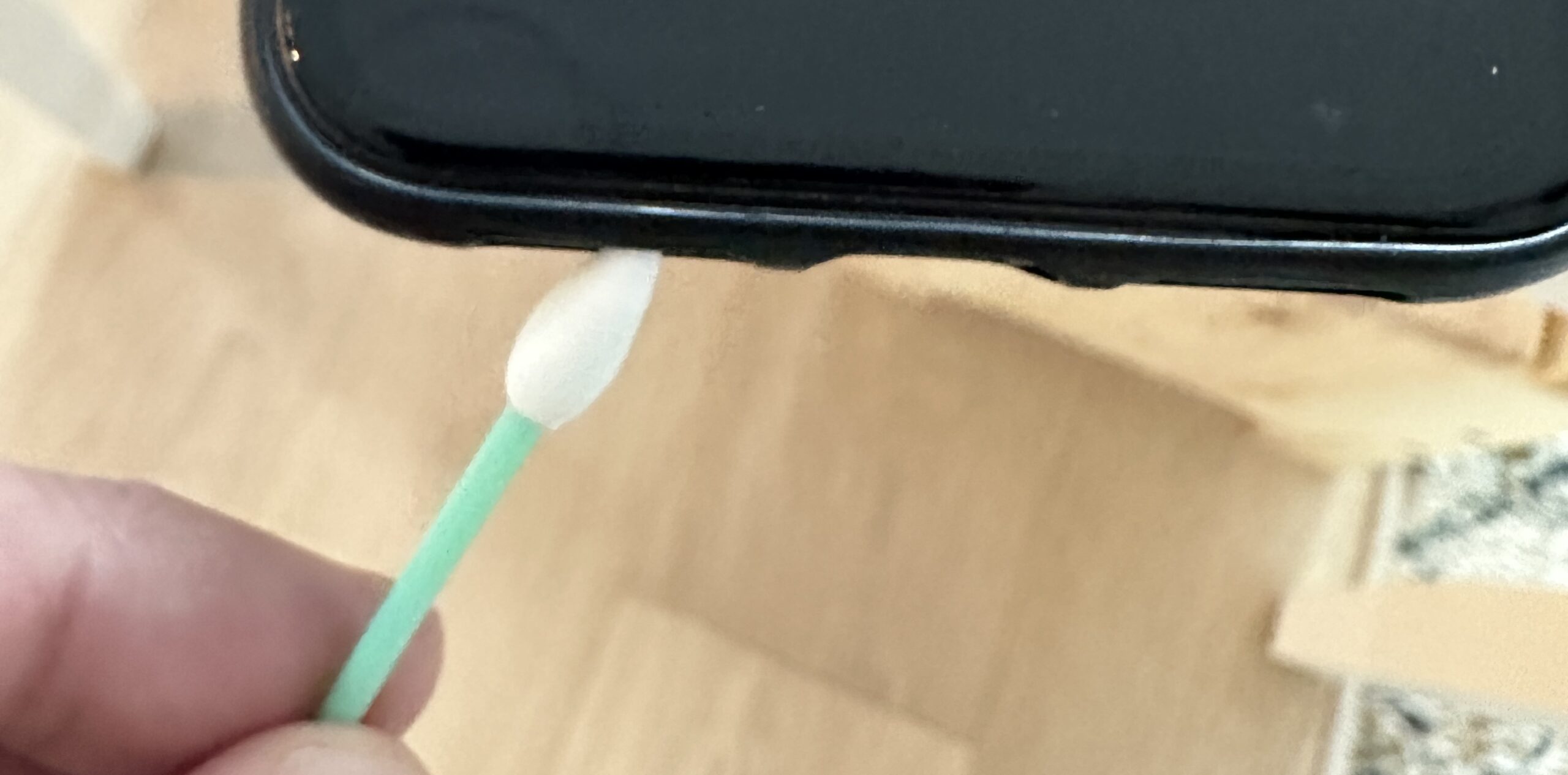 Using a q-tip to clean iPhone speakers