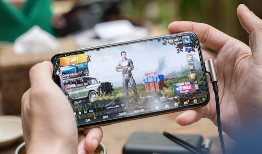 Person playing PUBG mobile on smartphone