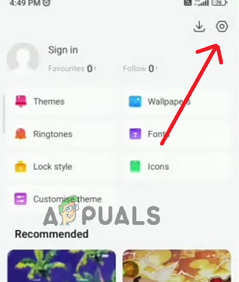 Look for the traditional settings icon at the top right corner