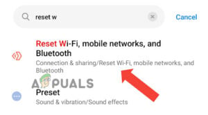Go to the “Reset mobile data, Wi-Fi, and Bluetooth” option