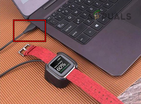 Plug the Fitbit Versa 2 into the USB Port of a System