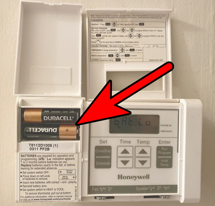 Insert the Batteries in the Honeywell Thermostat in the Reverse Polarity